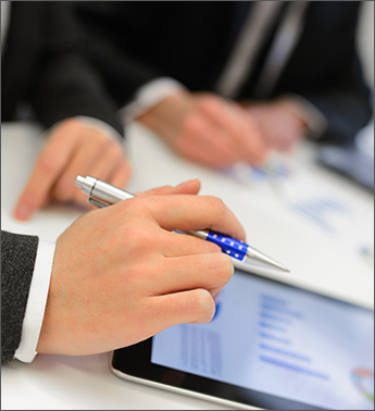 Man Managing a Business Report in a Tablet